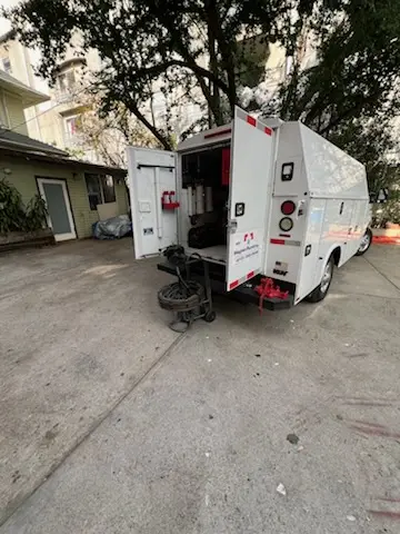 Magnet Plumbing service vehicle on-site for Slab Leak Repair in Mustang Pointe Aerodrome Condominiums